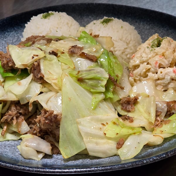 A plate of Momoyama Ramen & Hawaiian BBQ's beef and cabbage stir-fry with rice and macaroni salad.