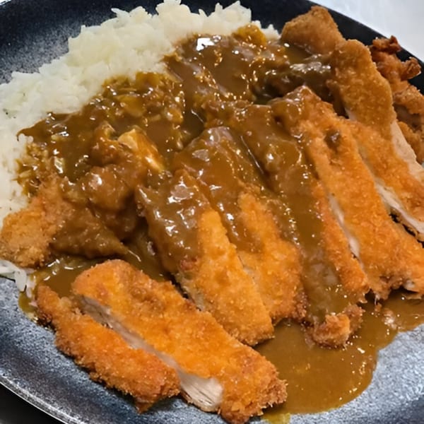 Crispy fried chicken katsu, sliced and covered in rich curry sauce, served with white rice.